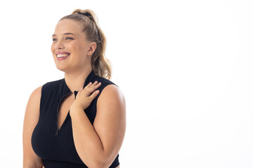 Blonde plus size model laughs, touches shoulder, on white background - 792788871