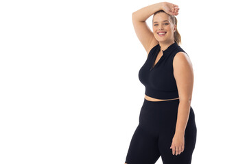 Caucasian young female plus size model on white background, copy space