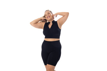 A young Caucasian plus-size model stands on white background, copy space - 792789469