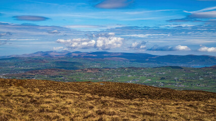 Spectacular view of The Mourne Mountains, including Slieve Donard, the surrounding countryside and all the way down to Carlingford Lough.  Taken from Slieve Gullion in The Ring of Gullion