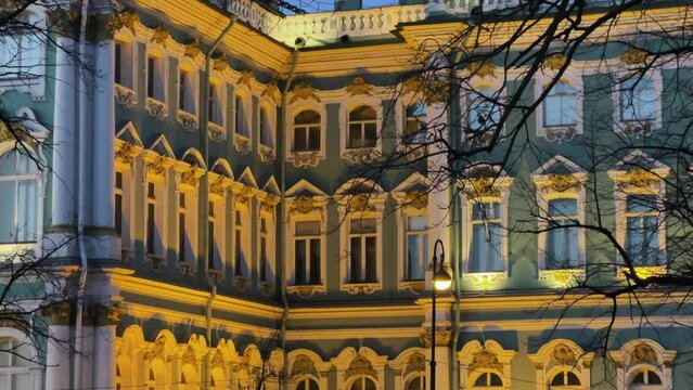 ST. PETERSBURG - APRIL 09, 2023: The Winter Palace in the night illumination on a cloudy April night. Evening view of the State Hermitage Museum in St. Petersburg. Museum on Palace Square. 4К