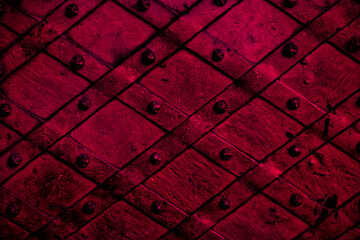 Closeup of red forged metal door - obrazy, fototapety, plakaty