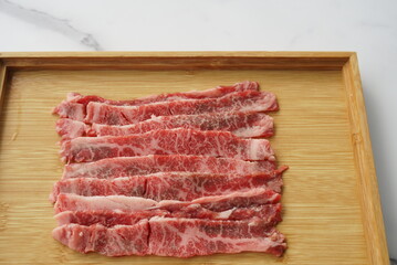 large beef cubes medium squares on wood