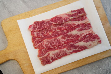 large beef cubes medium squares on wood