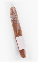 Fresh baguette in plastic packaging