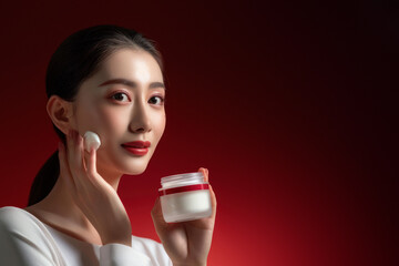 The image captures a woman applying facial cream with a serene expression in a warm, inviting light