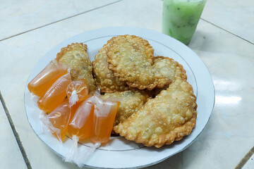 Indonesian Food - Jalangkote on a plate and Ice Melon ready to eat