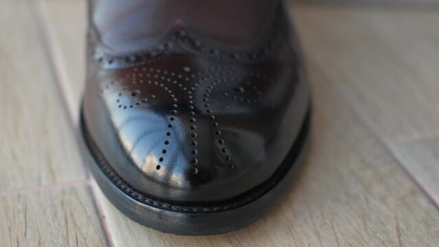 Expensive high-quality leather men's shoe close-up