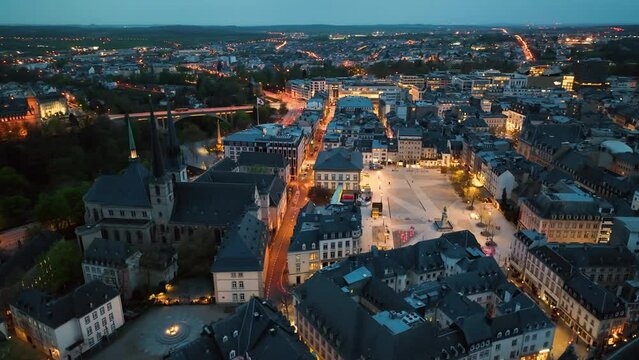 4K Aerial view of a Grand Duchy of Luxembourg , city skyline to night at Grund along Alzette river in the historical old town of Luxembourg