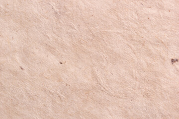 Textured beige wrinkled handmade paper background. Horizontal background for design