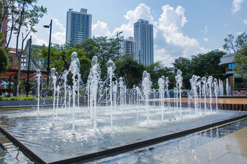 Public fountains in an urban setting run low - their dwindling water levels a stark illustration of water scarcity's grip on city life