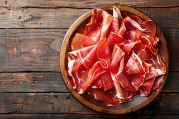 Spanish Delight: Jamon Iberico Tapas on Wooden Table with Copy Space. Authentic Catering with Cured Prosciutto from Iberian Ham - obrazy, fototapety, plakaty