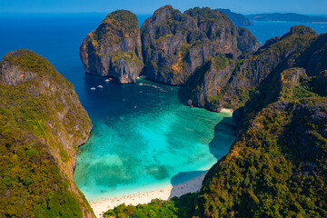 Amazing travel drone photo of landmark of Thailand island Ko Phi Phi Lee with paradise lagoon Maya Bay, white coral beach, reef with turquoise water