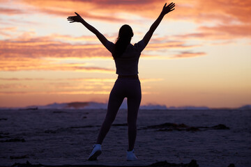 Woman, open arms and silhouette with stretch, sunset for freedom, faith and spiritual balance at...