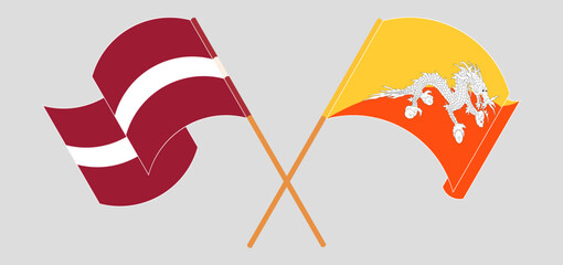 Crossed and waving flags of Latvia and Bhutan