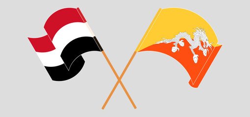 Crossed and waving flags of Yemen and Bhutan