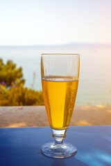 Glass of cold beer on a table in a hot country during vacation.
