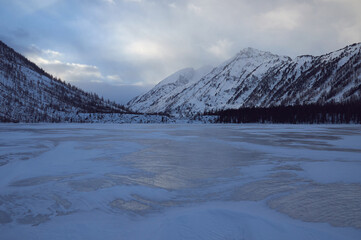 Snow-covered winter mountain lake, Russia, Siberia, Altai mountains.