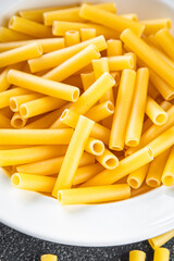 raw pasta tortiglioni cooking appetizer meal food snack on the table copy space food background rustic top view
