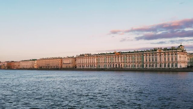 St. Petersburg, Russia - April 20, 2024. The University embankment of the Neva River. View of the sights of the city from the palace bridge. Panoramic view of the Neva River and the Palace embankment.
