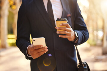 Hand, phone and text on road, coffee and communication with company, New York and travel to office. Street, suit and person with mobile, professional and online for connection of publicist outdoor