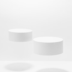 Set of two round white pedestals for cosmetic products mockup, fly in hard light with shadow on white background. Stage for presentation skin care products, gifts, goods, advertising in summer style.