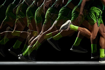 Power and athleticism. Cropped image of athletic, muscular male legs in motion, running against...