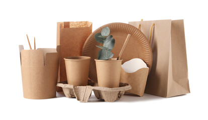 Eco friendly food packagings, tableware, paper bags and eucalyptus leaves isolated on white