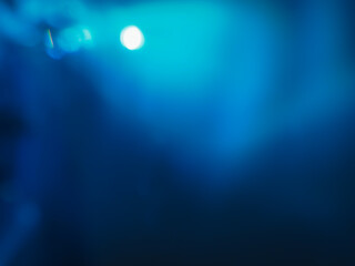 Blurred blue lights in the dark for a mysterious background.  