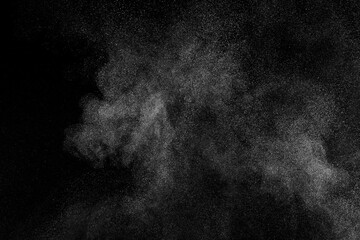 Fototapeta premium White texture on black background. Dark textured pattern. Abstract dust overlay. Light powder explosion. 