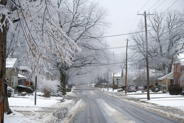 A severe ice storm leaves a dangerous yet beautiful glaze over trees and power lines in a suburban neighborhood