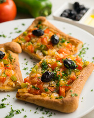 Coca de trampó or trempó is one of the most typical and traditional dishes of Balearic gastronomy...