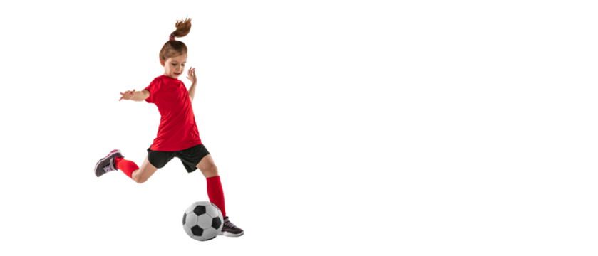 Portrait of athletic, fit child, girl in red uniform playing, training pass technique against transparent background. Sportive and active kid. Concept of action, team sport game, energy, vitality.
