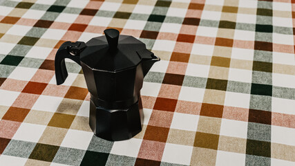 Black coffee pot on the table