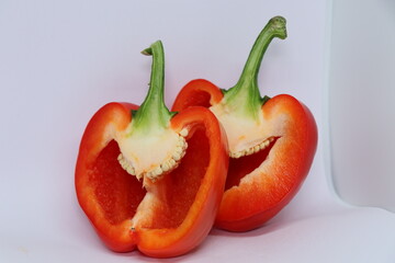 sweet red juicy Bulgarian pepper on a white background