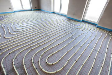 underfloor heating system in construction of new built house - 792935044