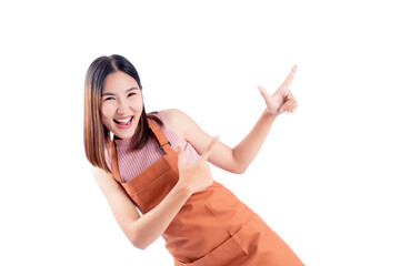 Excited young woman in an apron pointing at empty space, perfect for advertisements and promotions.
