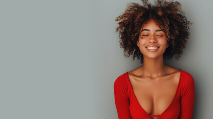 Afro woman in red halter V-Neck smiling isolated on gray - Powered by Adobe