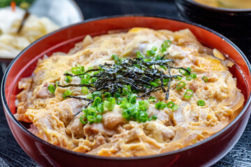 A delicious Japanese dish with chicken, egg, and rice.