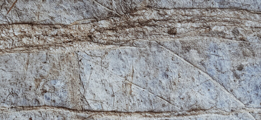 Rock, stone, textured. Stone wall background with space for design. Cracked rough mountain surface