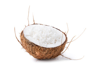 Coconut flakes in nut shell isolated on white - obrazy, fototapety, plakaty