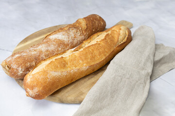 Freshly baked bread on a cutting board.
