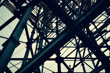 The geometric shapes of scaffolding and steel beams creating a dynamic silhouette, super realistic