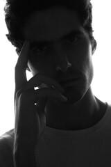 A moody closeup portrait of a young man