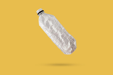 recycled plastic bottle isolated on yellow background - 792977683