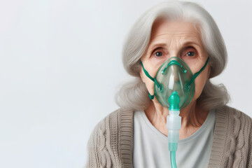 an old woman in an oxygen mask on a white background - obrazy, fototapety, plakaty