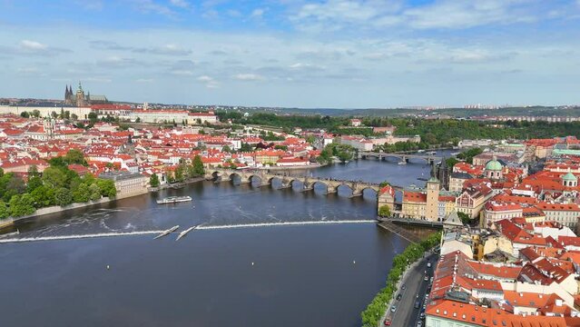Prague, capital city of the Czech Republic, is bisected by the Vltava River. Charles Bridge is a medieval stone arch bridge that crosses the Vltava river in Prague, Czech Republic.