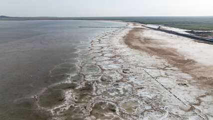 cosmic unreal landscapes of the Baskunchak salt lake on a spring day from the height of a drone...