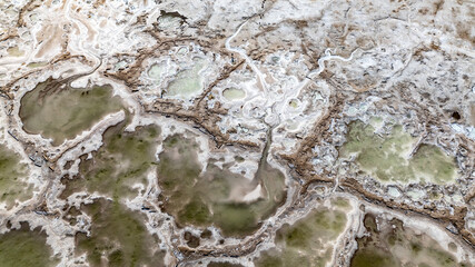 cosmic unreal landscapes of the Baskunchak salt lake on a spring day from the height of a drone flight