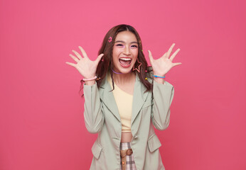 Young Asia girl feel happiness with positive expression, joyful surprise laugh isolated on pink background.